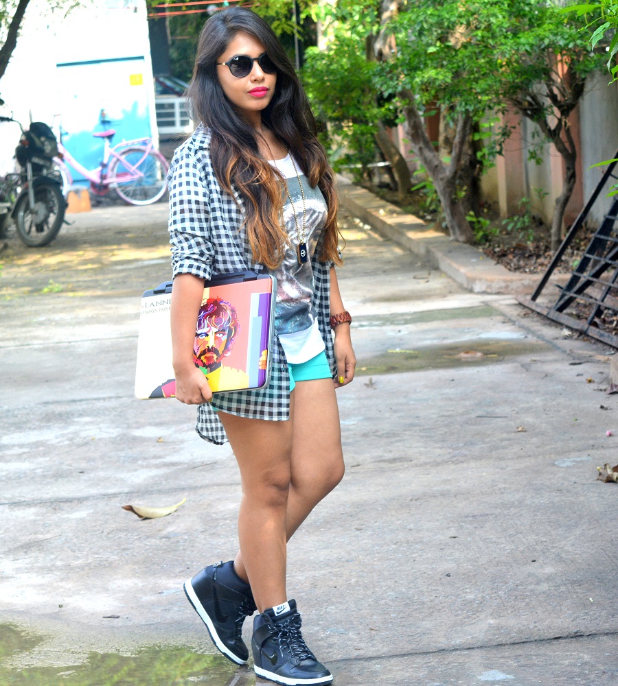 girl-in-plaid-shirt-shorts-with-sunglasses-and-nike-shoes